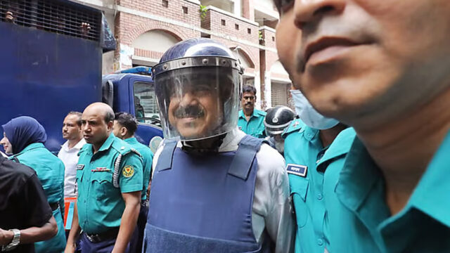 Police Escort Former Shipping Minister